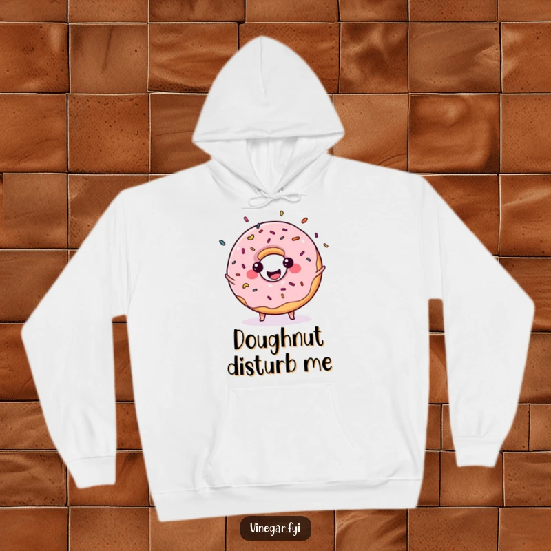 Funny hoodie showing a kawaii donut juggling sprinkles with a big smile, symbolizing playful energy and sweet delight.