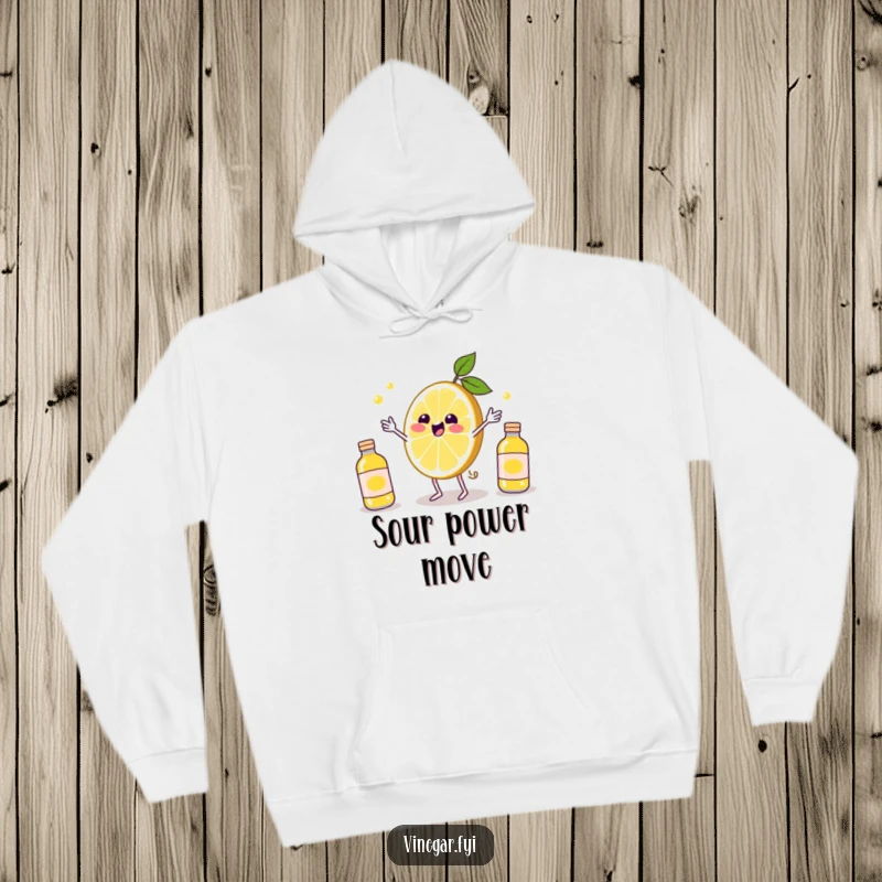 Funny Kawaii lemon slice, looking thrilled, juggling miniature vinegar bottles on this warm and humorous citrus-themed hoodie. Cozy fun.