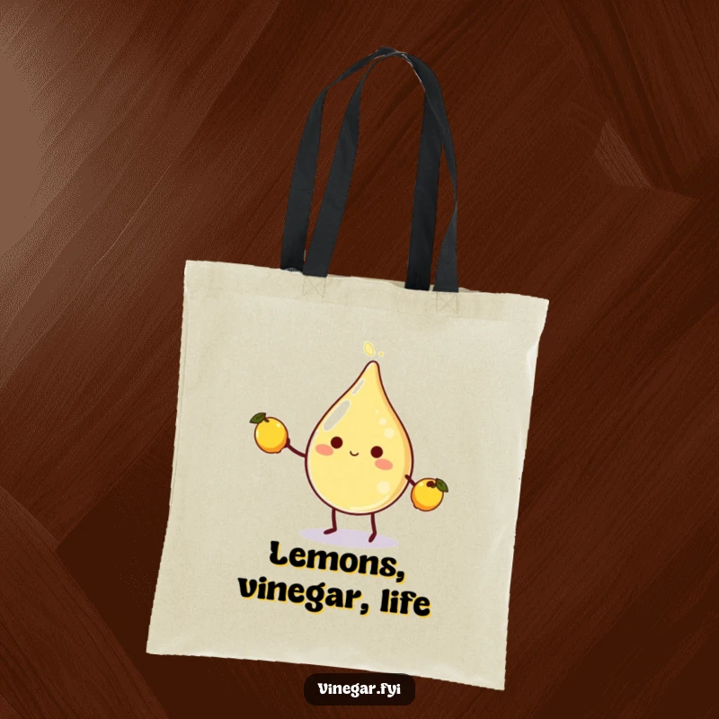 Funny vinegar droplet character juggling lemons on a durable tote bag, ideal for grocery shopping or as a humorous accessory.